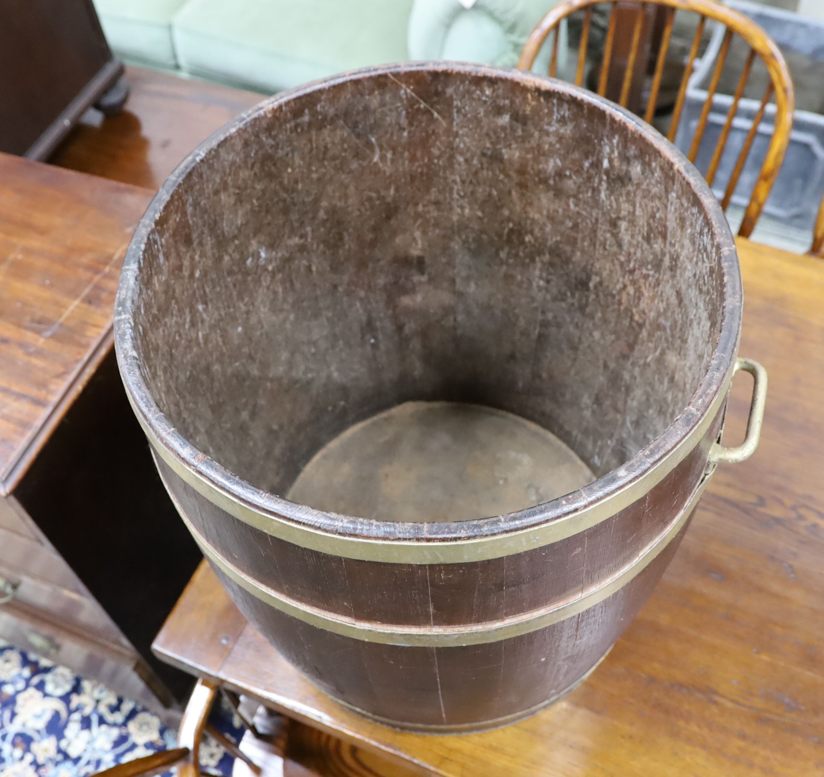 A large brass bound staved oak tub, diameter 54cm, height 61cm